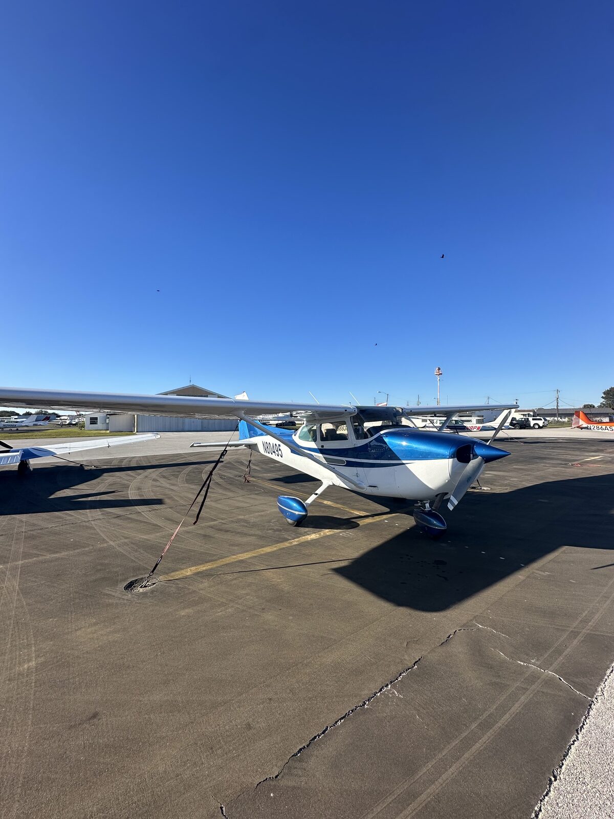 Cessna 172 N80495 on the ramp at Merritt Island Airport under clear skies